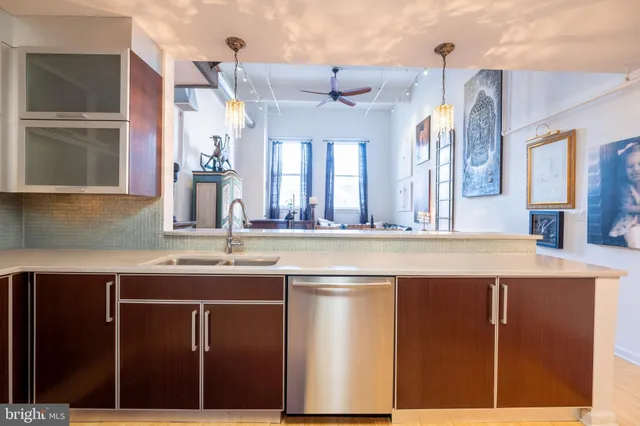 a kitchen with stainless steel appliances granite countertop a sink and cabinets