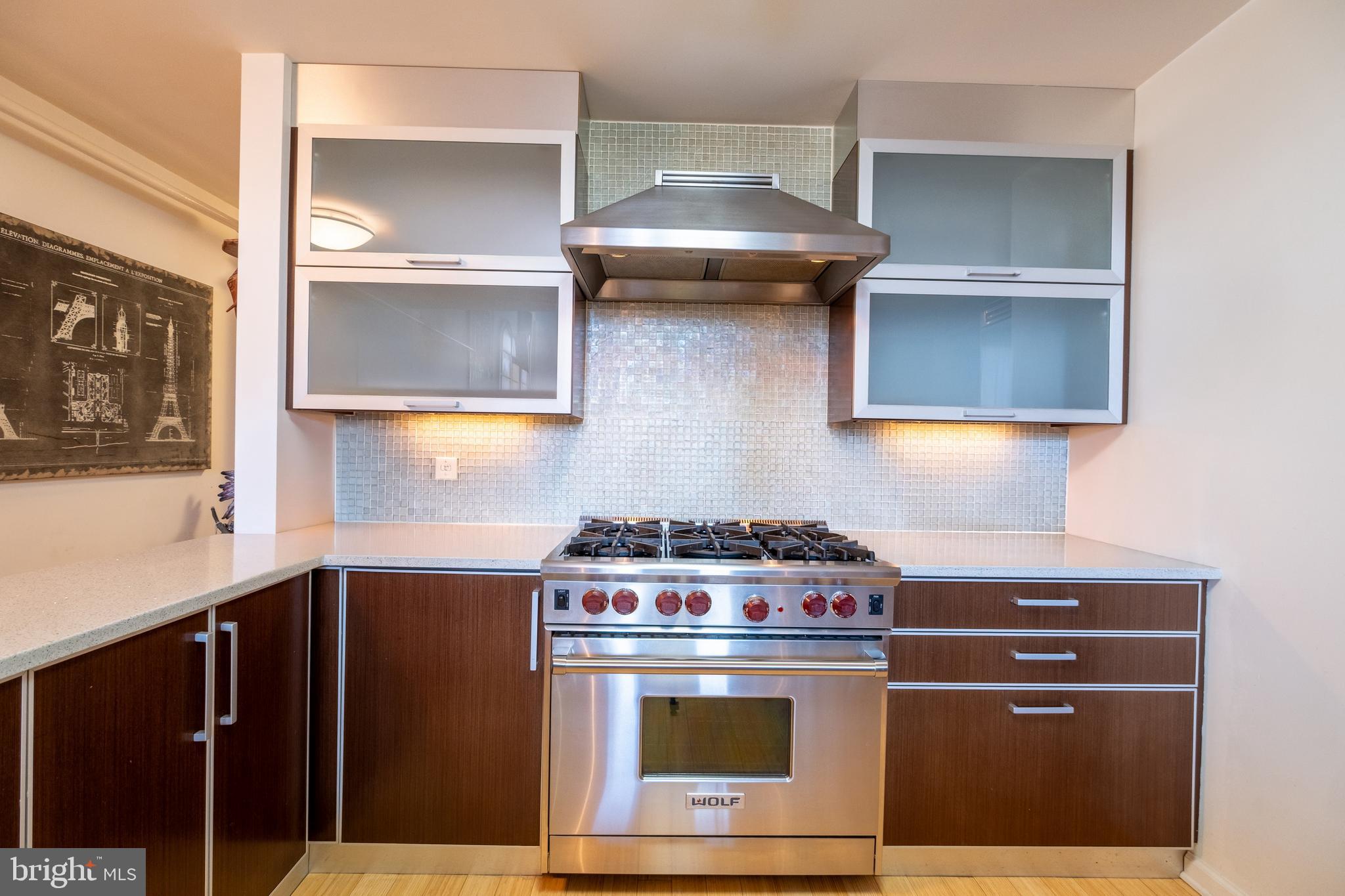 1228 Arch Street, Unit 8D Philadelphia, PA 19107 - Photo 5 of 26 a stove top oven sitting inside of a kitchen