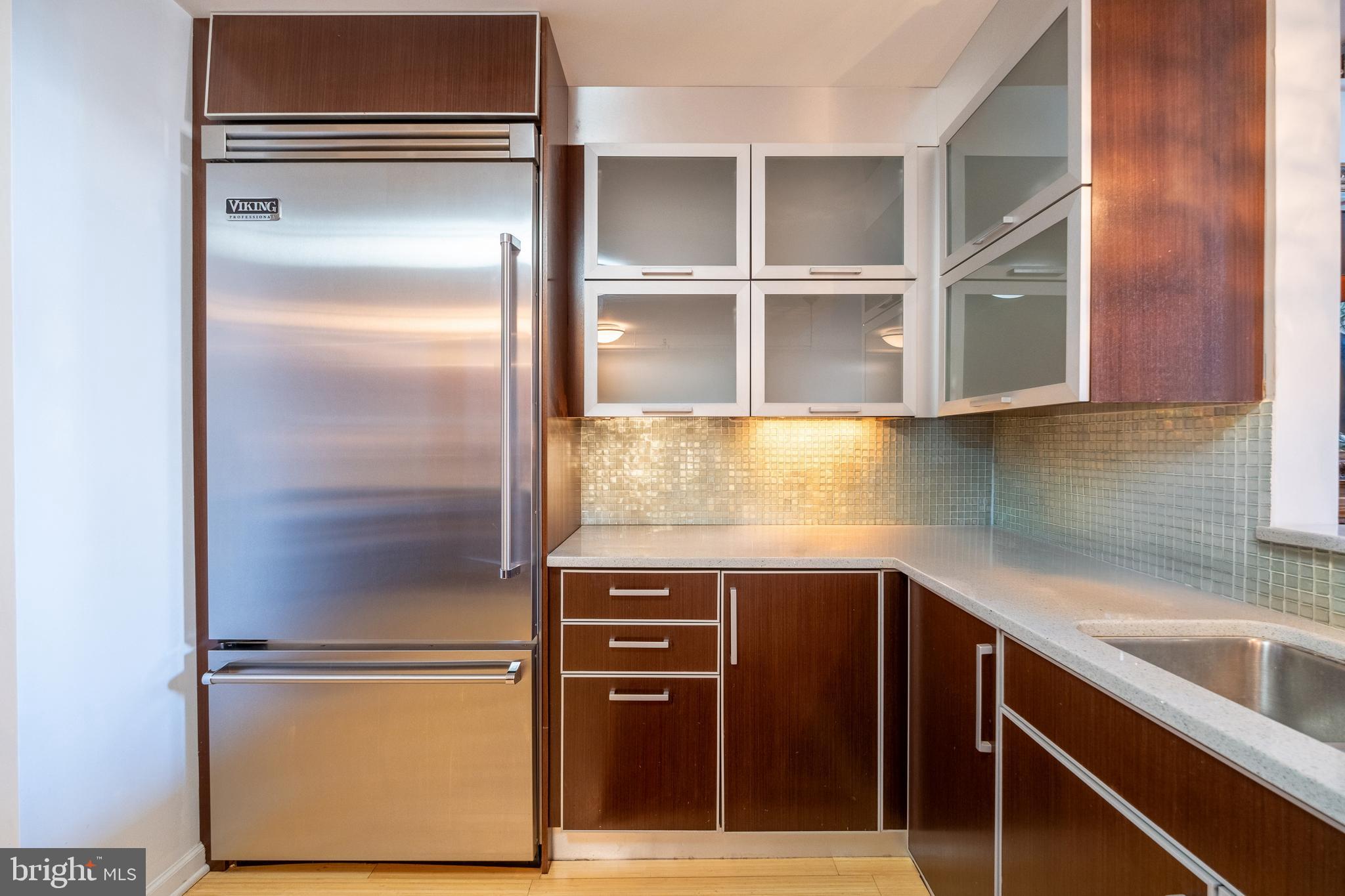 1228 Arch Street, Unit 8D Philadelphia, PA 19107 - Photo 6 of 26 a kitchen with a refrigerator and cabinets