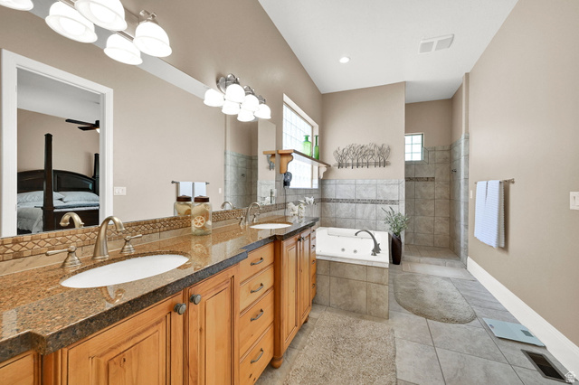 1926 East Gray Fox Drive Draper, UT 84020 - Photo 14 of 31 Primary bathroom featuring a double vanity, granite countertops and tons of lighting.