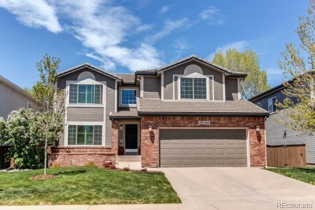 10144 Alexa Lane Highlands Ranch, CO 80130 - Photo 1 of 33 front view of a house with a yard