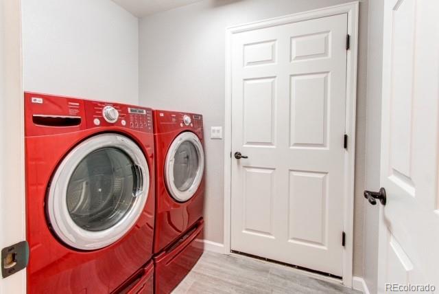 10144 Alexa Lane Highlands Ranch, CO 80130 - Photo 15 of 33 a utility room with dryer and washer