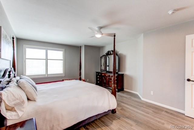 10144 Alexa Lane Highlands Ranch, CO 80130 - Photo 20 of 33 a bedroom with a bed and a large window