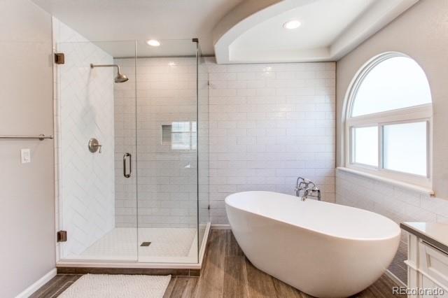 10144 Alexa Lane Highlands Ranch, CO 80130 - Photo 23 of 33 a white bath tub sitting next to a bathroom sink