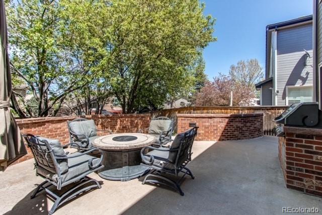 10144 Alexa Lane Highlands Ranch, CO 80130 - Photo 32 of 33 a view of a patio with a table and chairs in the patio