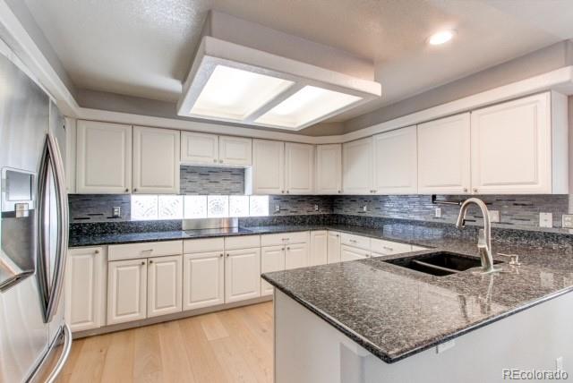10144 Alexa Lane Highlands Ranch, CO 80130 - Photo 6 of 33 a kitchen with stainless steel appliances granite countertop a sink a stove and cabinets