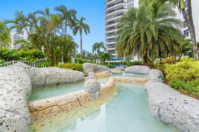 an aerial view of a house with a swimming pool