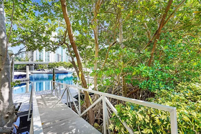 a swimming pool with outdoor seating and yard