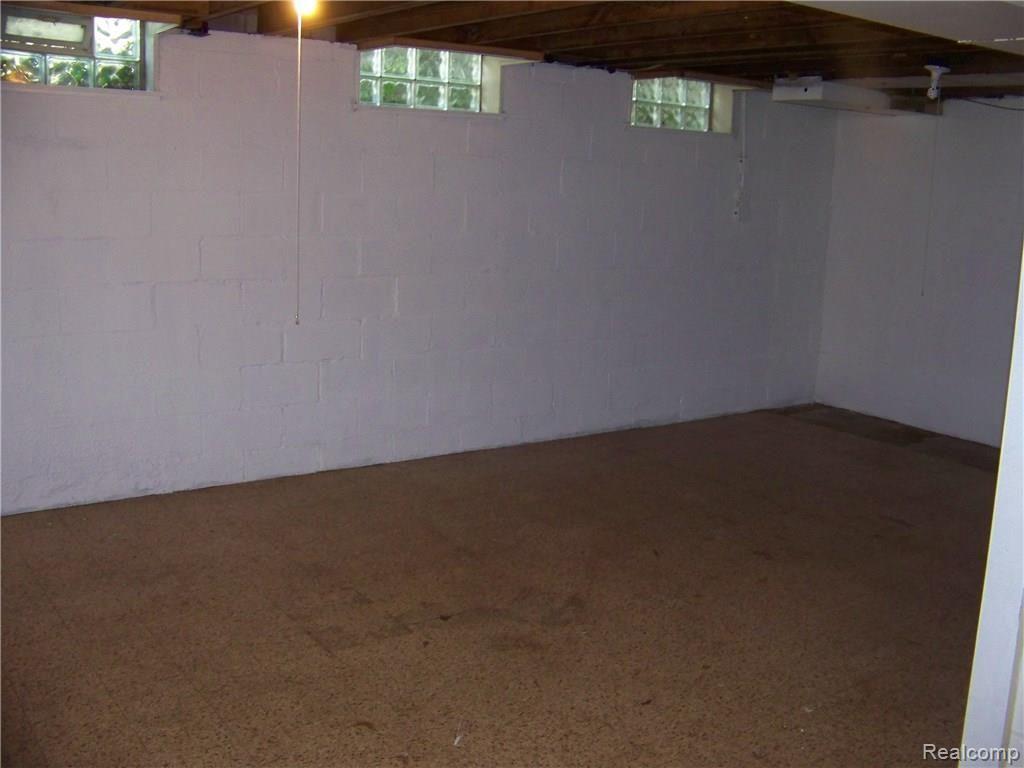 135 Maplefield Road Pleasant Ridge, MI 48069 - Photo 24 of 35 PERFECT SIZE FOR A FAMILY ROOM OR A 3RD BEDROOM! GLASS BLOCK WINDOWS, TOO!