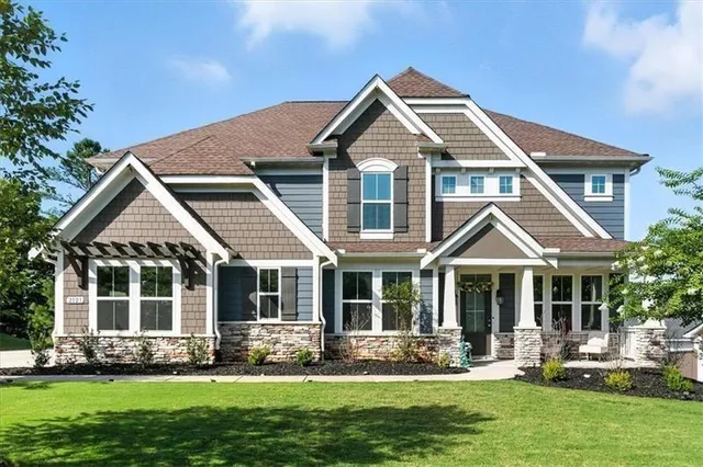 a front view of a house with a yard