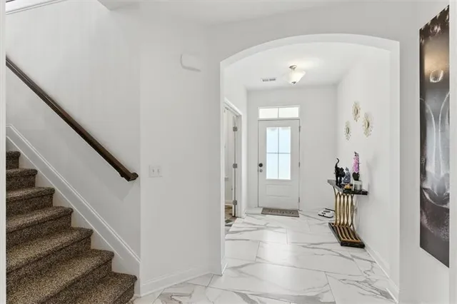 a view of a hallway view with staircase