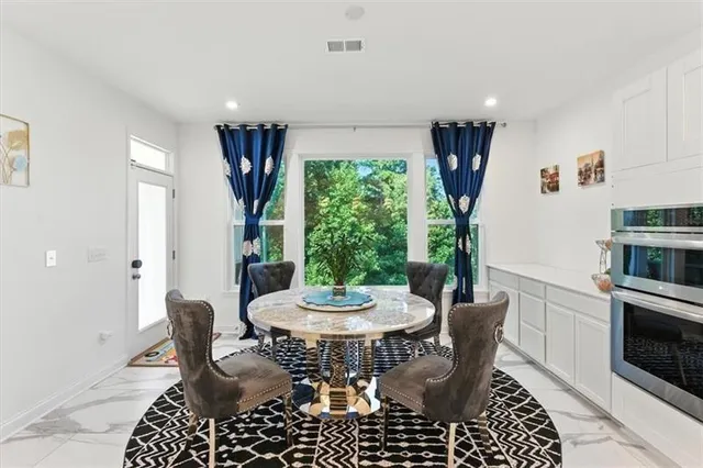 a view of a dining room with furniture window and outside view