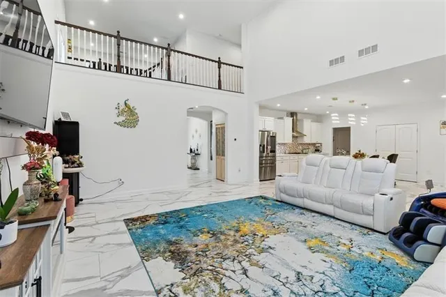 a living room with furniture and a rug