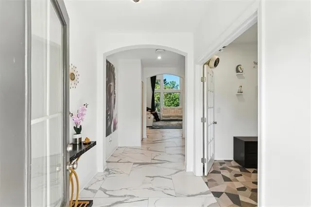 a view of a hallway view with three rooms