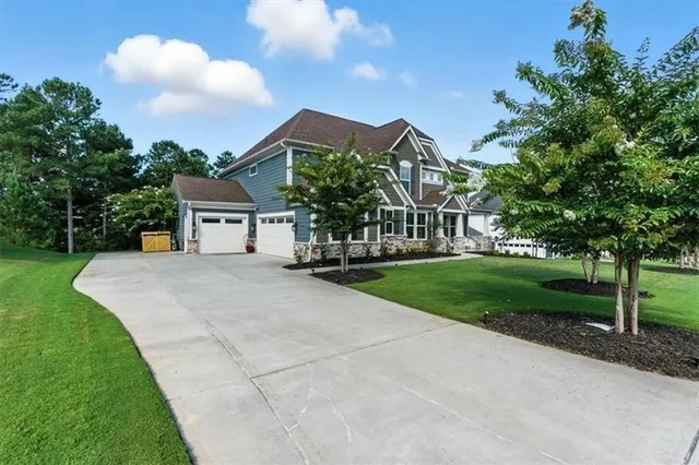 a front view of a house with garden