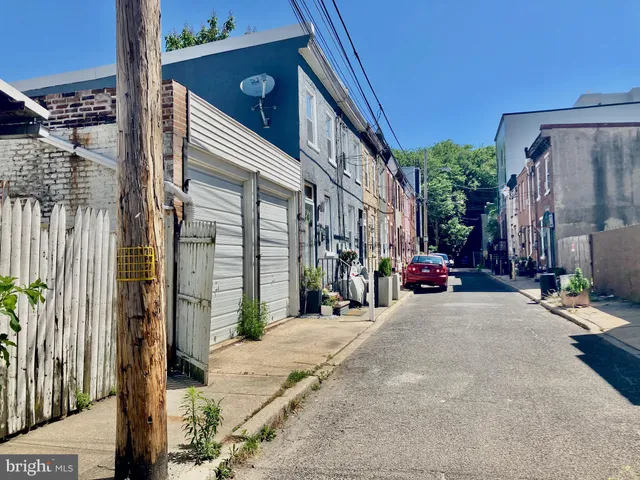 a view of a street with a building in the background