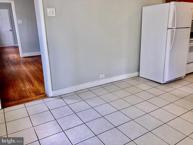 a view of a utility room with wooden floor