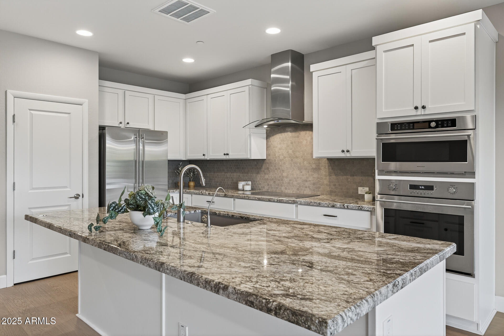17662 East Chevelon Canyon Circle Rio Verde, AZ 85263 - Photo 7 of 31 a kitchen with stainless steel appliances granite countertop a sink stove and refrigerator