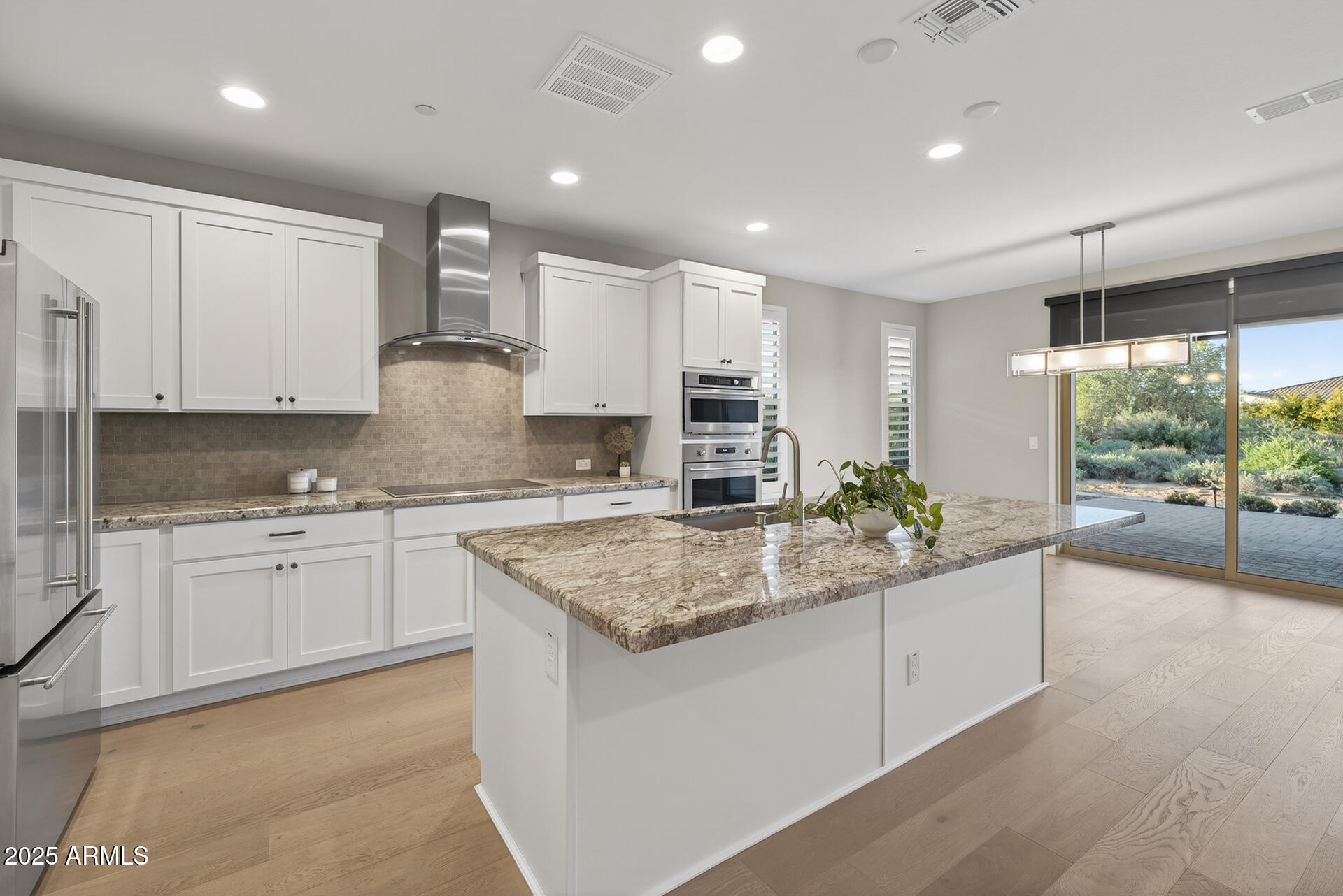 17662 East Chevelon Canyon Circle Rio Verde, AZ 85263 - Photo 8 of 31 a kitchen with stainless steel appliances granite countertop refrigerator sink and cabinets
