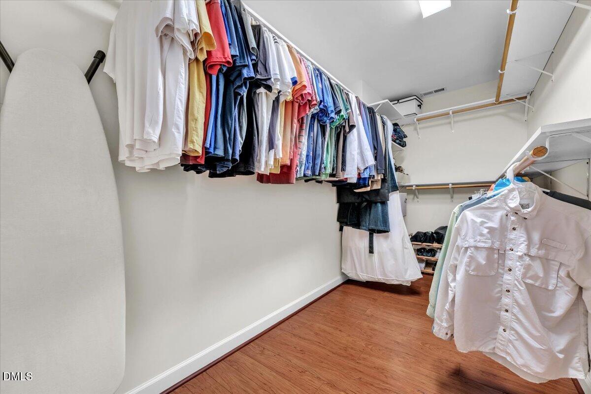 2908 Oak Bridge Drive Raleigh, NC 27610 - Photo 26 of 47 a view of walk in closet with clothes