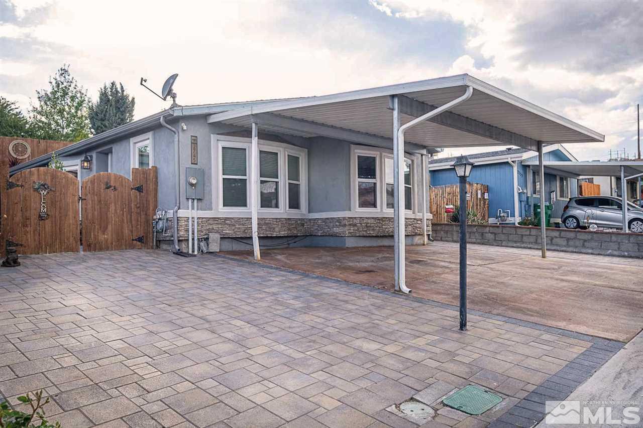 2745 Snapdragon Way Reno, NV 89512 - Photo 1 of 30 a front view of a house with garden