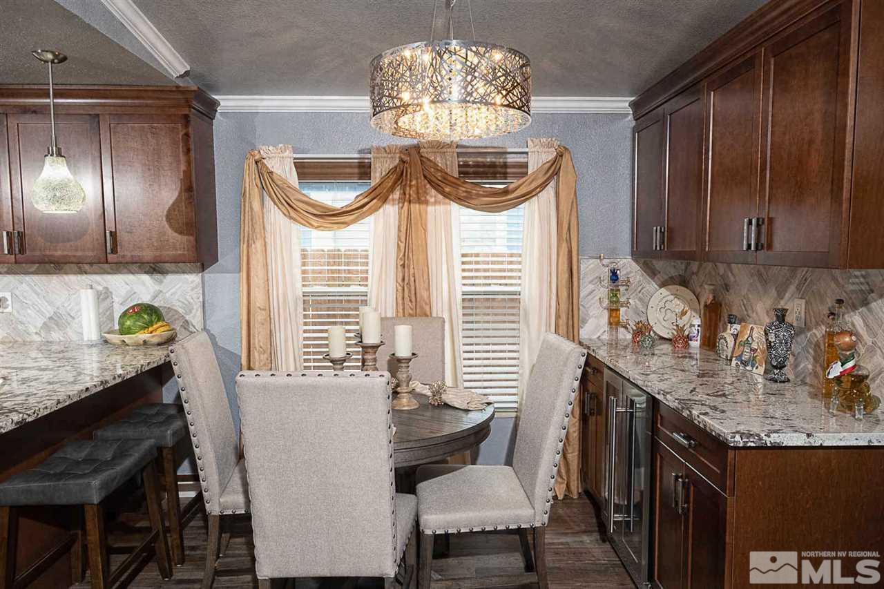 2745 Snapdragon Way Reno, NV 89512 - Photo 11 of 30 a dining room with furniture and window