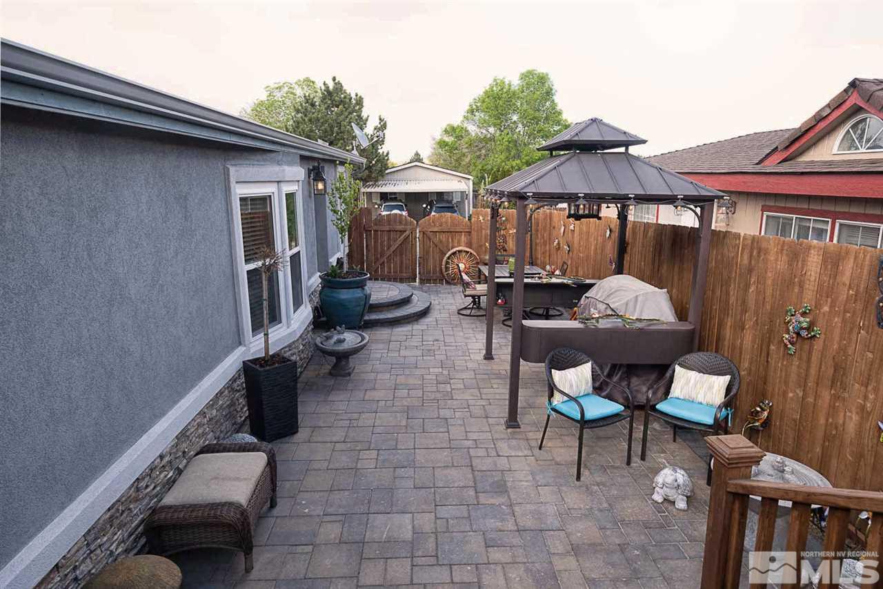 2745 Snapdragon Way Reno, NV 89512 - Photo 20 of 30 a backyard of a house with seating space