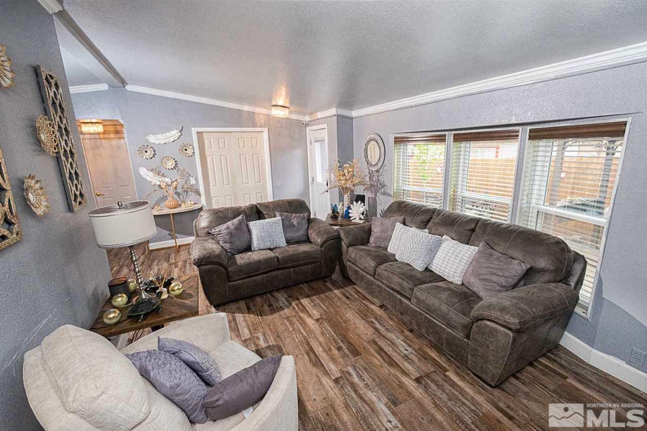 2745 Snapdragon Way Reno, NV 89512 - Photo 2 of 30 a living room with furniture and a large window