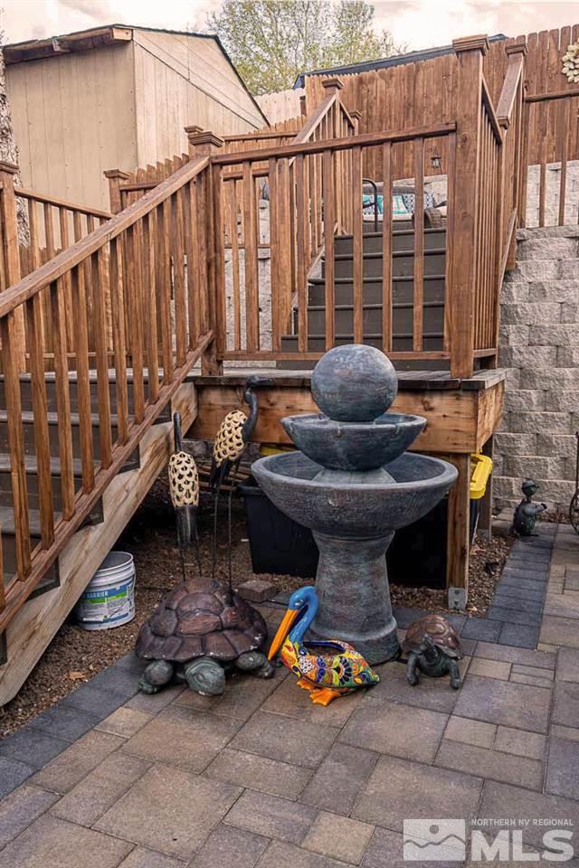 2745 Snapdragon Way Reno, NV 89512 - Photo 23 of 30 a view of a balcony with chairs and a potted plant