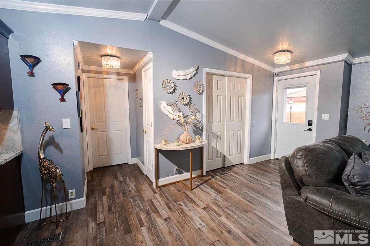 2745 Snapdragon Way Reno, NV 89512 - Photo 4 of 30 a living room with furniture and wooden floor