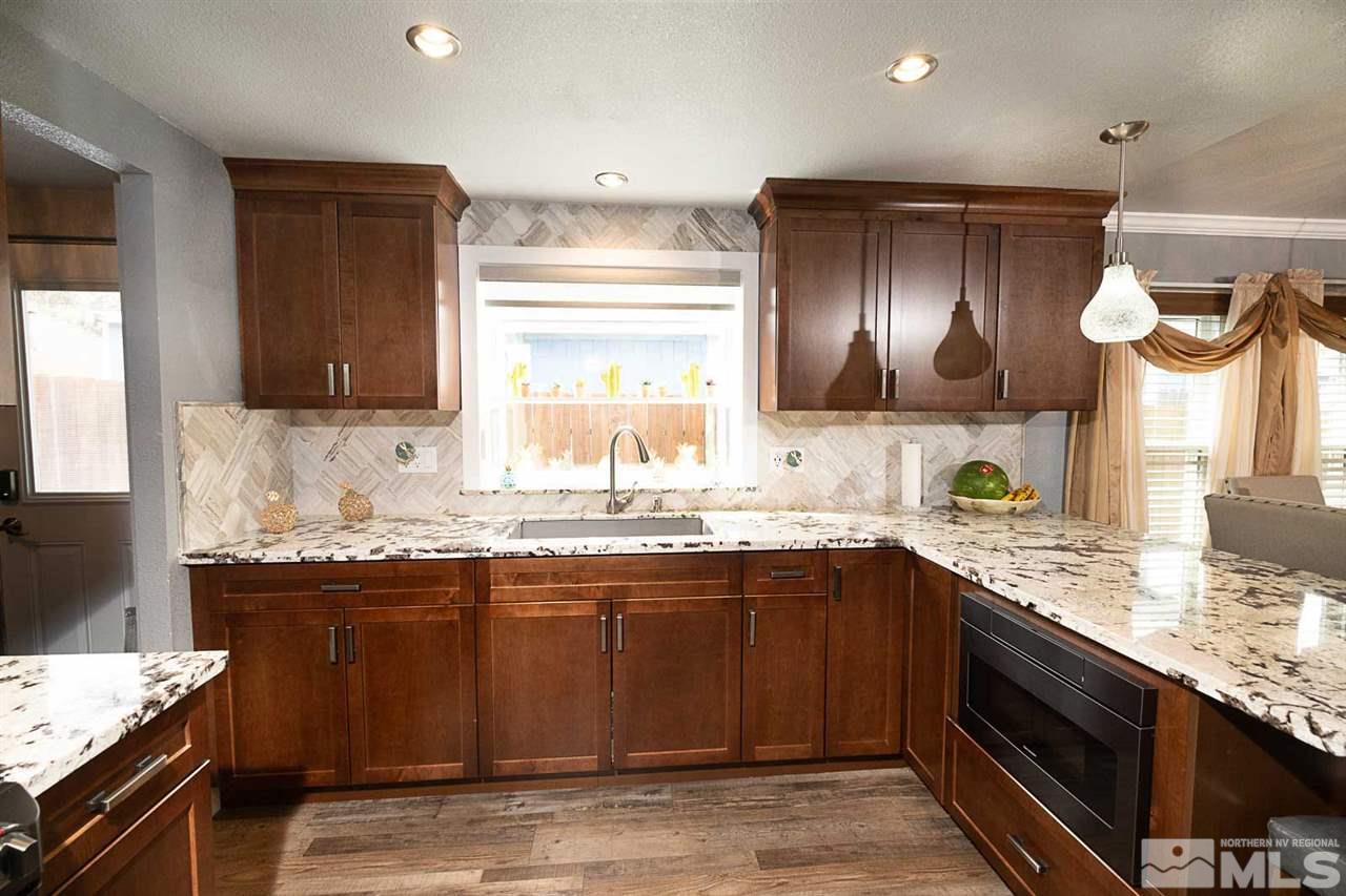 2745 Snapdragon Way Reno, NV 89512 - Photo 9 of 30 a kitchen with a sink and cabinets