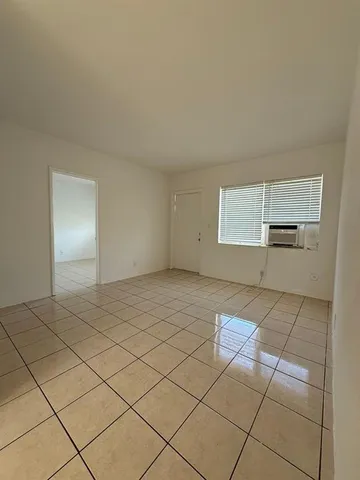a view of an empty room and window