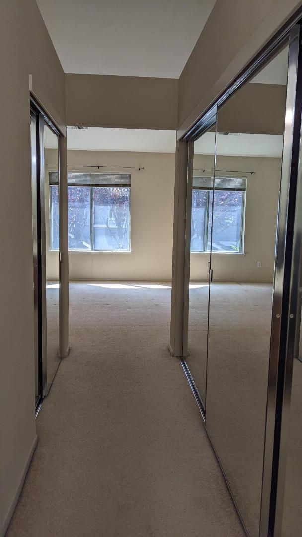 5691 Spry Common Fremont, CA 94538 - Photo 14 of 20 a view of an empty room with a painting on the wall