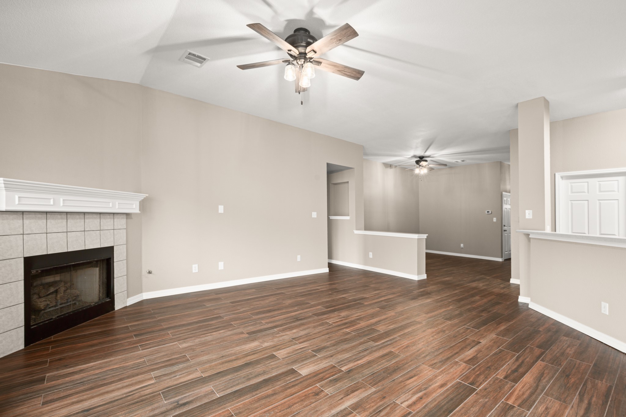 3420 Ribbon Reef Lane Austin, TX 78728 - Photo 9 of 25 Family room with corner fireplace (gas starter), tile floors