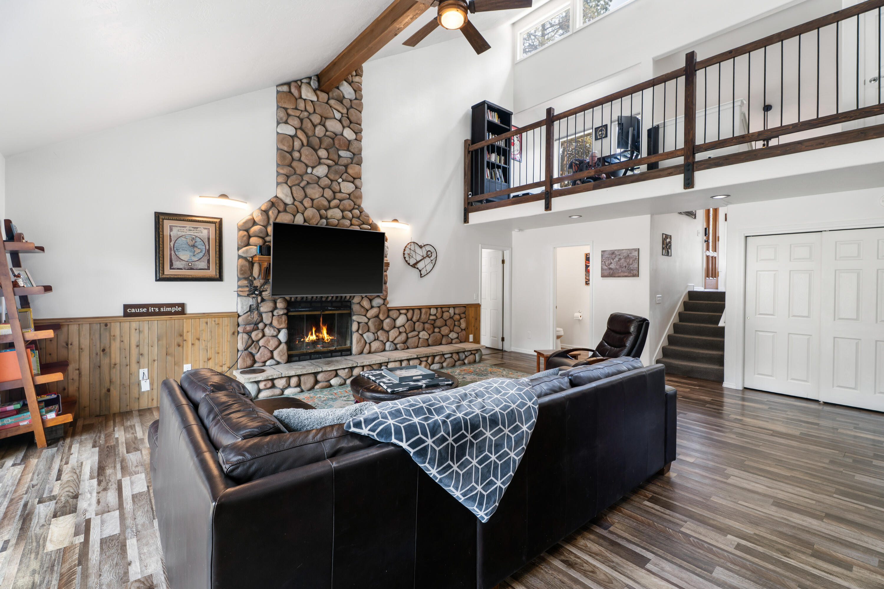 17062 Milky Way Bend, OR 97707 - Photo 8 of 39 Two-story living room with mountain-cabin scale, exposed beams, and modern light