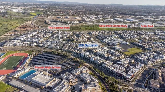 an aerial view of residential houses with outdoor space