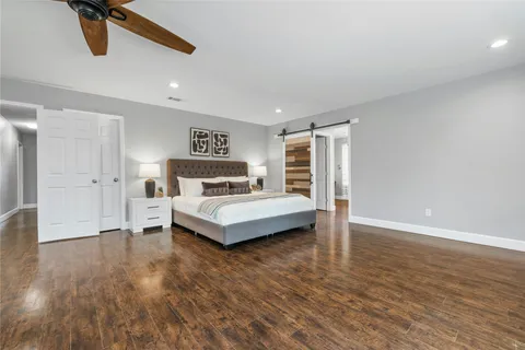 a bedroom with a bed and a table