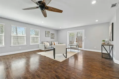 a living room with fireplace furniture and a window