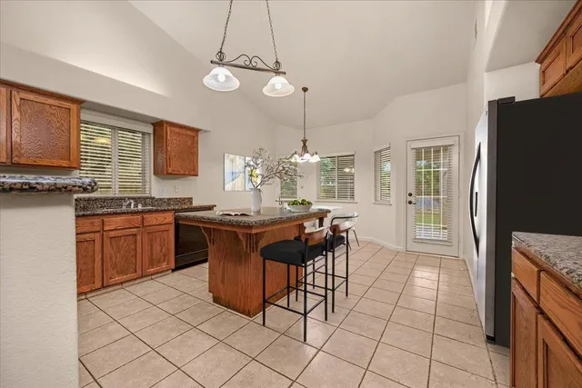 a kitchen with stainless steel appliances a sink stove and refrigerator