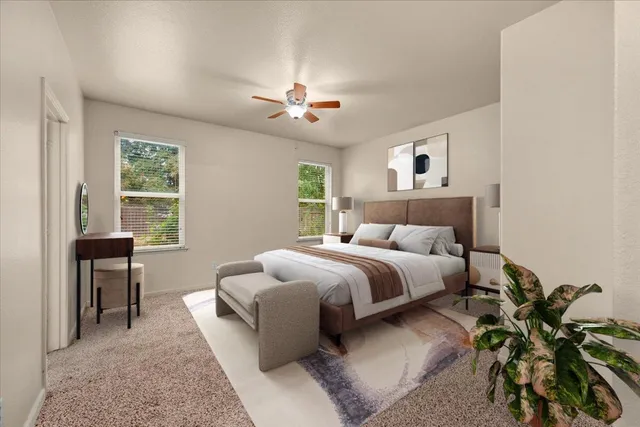 a bed room with a bed and a chair