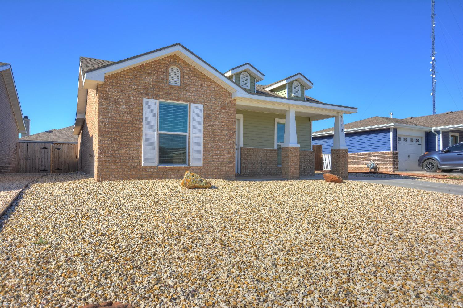 7513 28th Street Lubbock, TX 79407 - Photo 3 of 18 a front view of a house with a yard