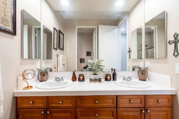 a bathroom with a sink and a mirror