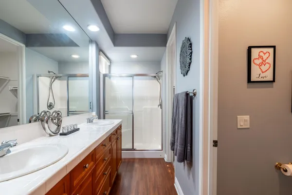 a bathroom with a double vanity sink mirror and double