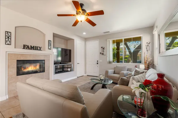 a living room with furniture and a fireplace