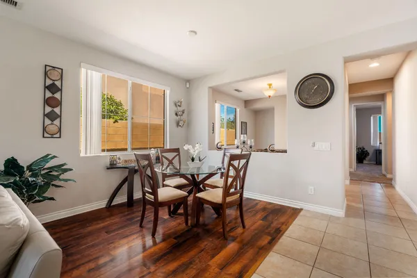 a view of a dining room with furniture and window