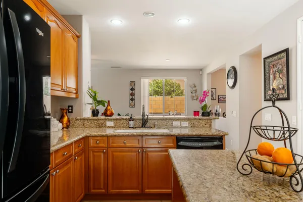 a kitchen with a sink and a stove top oven