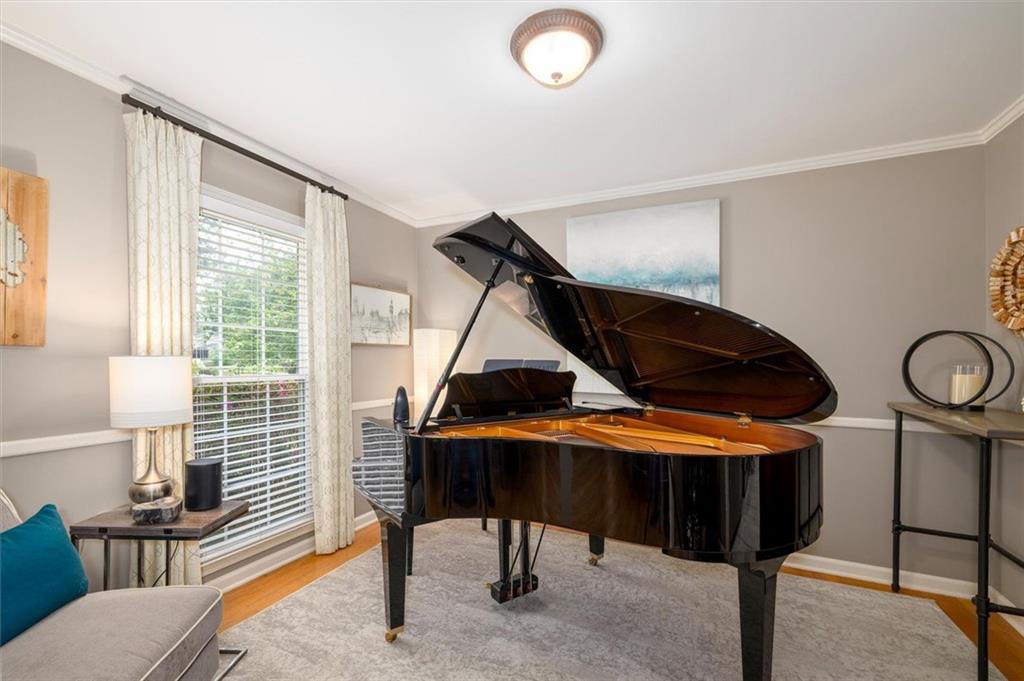 2282 Marthasville Court Smoke Rise, GA 30087 - Photo 11 of 48 a bedroom with furniture and a window