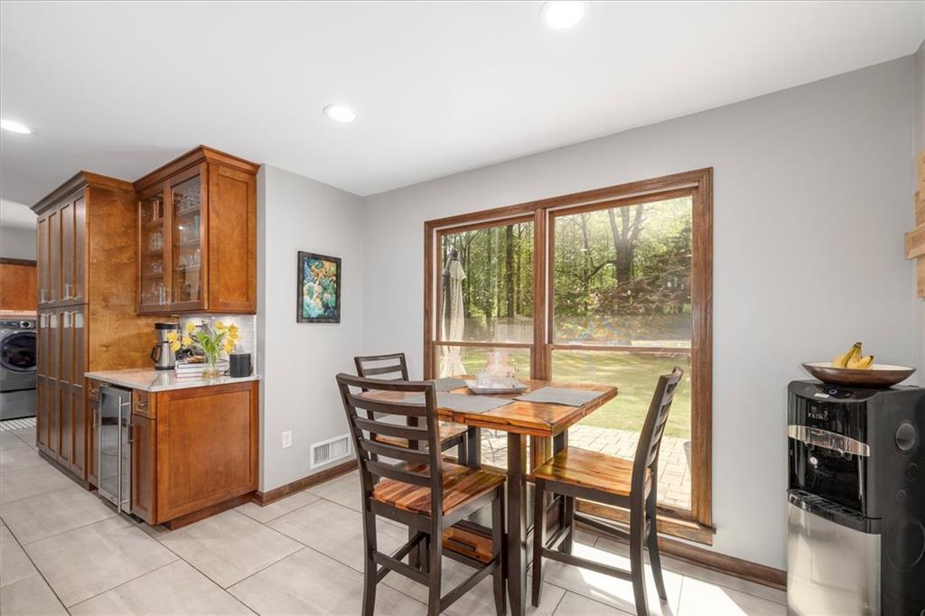 2282 Marthasville Court Smoke Rise, GA 30087 - Photo 15 of 48 a view of a dining room with furniture and chandelier