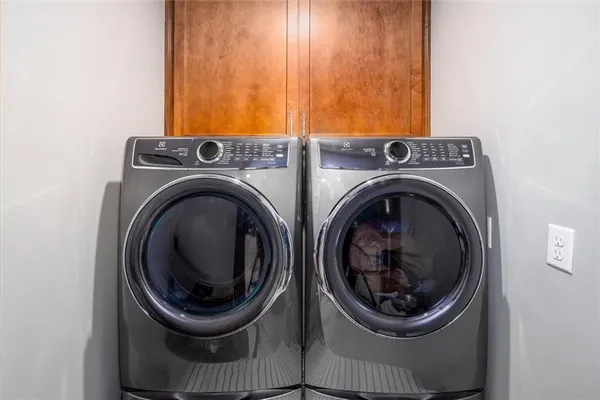 a utility room with dryer and washer