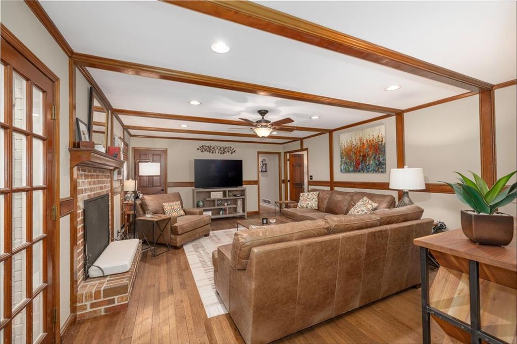 2282 Marthasville Court Smoke Rise, GA 30087 - Photo 18 of 48 a living room with furniture and a flat screen tv